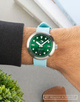 Man wearing the Agumbe wristwatch with an FKM Nicobar Blue strap, highlighting its sleek design and bold look.