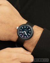 Man wearing Mannar wristwatch with striking BWC signature Kumaon black FKM hight density rubber strap.