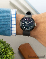 Man wearing Mannar wristwatch on his wrist, showcasing the watch’s sleek design and modern style.