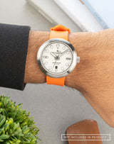 Man wearing the Mannar wristwatch with an FKM Sundarban Orange strap, highlighting its sleek design and bold look.