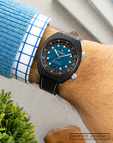 Man wearing Karman Line wristwatch on his wrist, showcasing the watch’s sleek design and modern style.