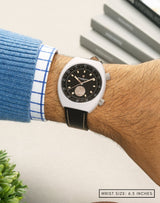 Man wearing Manzinus watch on wrist, highlighting the meteorite dial and sleek white case.