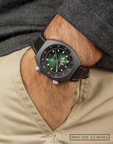 Man wearing Supernova watch with hand in pocket, highlighting the green fumé dial and unique sunray pattern.