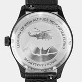 Close-up of the MACH 1 Avalanche wristwatch caseback, depicting a helicopter flying above towering peaks.