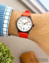 MACH 1 Avalanche watch on wrist, featuring a red strap and a dial that stands out with its intricate details.
