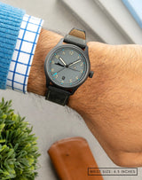 Man wearing MACH 1 Admiral watch on wrist, showcasing the distinctive grey dial inspired by the INS Vikrant.