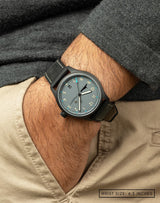 Man wearing MACH 1 Admiral wristwatch with hand in pocket, highlighting the watch’s unique dial and navy-inspired design.