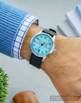 The Officer's Blue watch on the wrist, featuring the striking blue dial and sleek stainless steel case.
