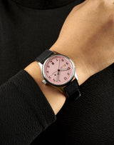 Woman wearing MACH 1 Silk Scarf wristwatch from chest angle, focusing on the unique Frostpeak dial pattern and aviation style.