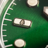 Agumbe wristwatch featuring a deep green dial color with suburst pattern.