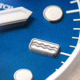 Laccadive wristwatch featuring a deep blue dial color with sunburst pattern.