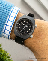 Man wearing Apogee Visitor on wrist, highlighting the 4.5 billion-year-old Muonionalusta meteorite dial in a Cerasteel™ case.