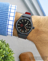 Man wearing MACH 1 Synchro wristwatch on wrist, highlighting the unique dial and aviation-inspired design.