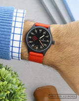 Wrist shot of MACH 1 Synchro paired with red strap, showing its details.