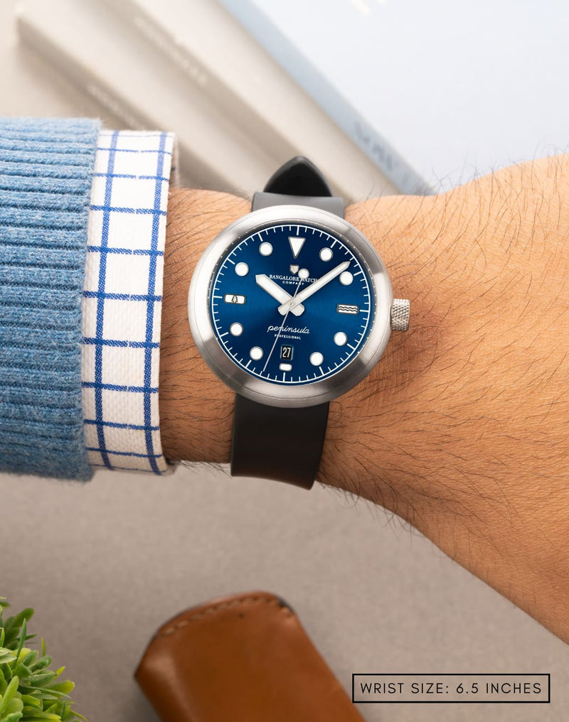 Man wearing Laccadive wristwatch on his wrist, showcasing the watch’s sleek design and modern style.