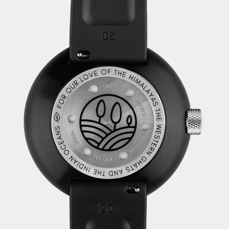 Caseback of the Mannar wristwatch featuring nature inspired iconography with text on the periphery.