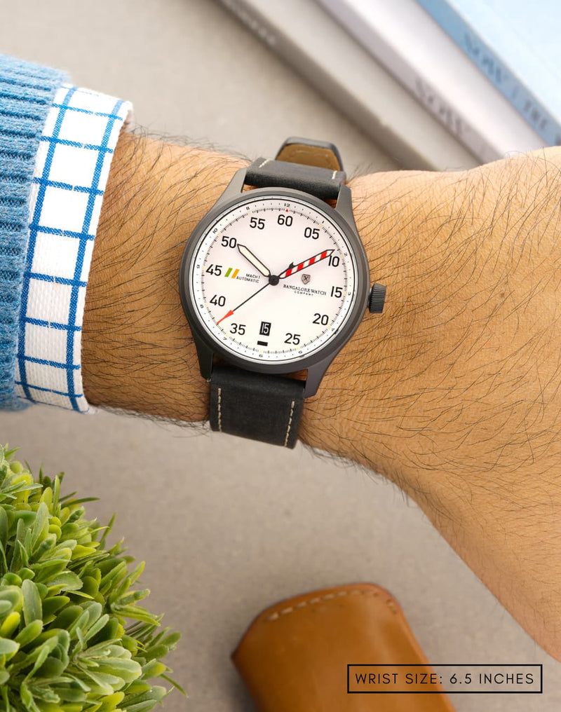 Man wearing MACH 1 Avalanche watch on wrist, focusing on the unique dial pattern.