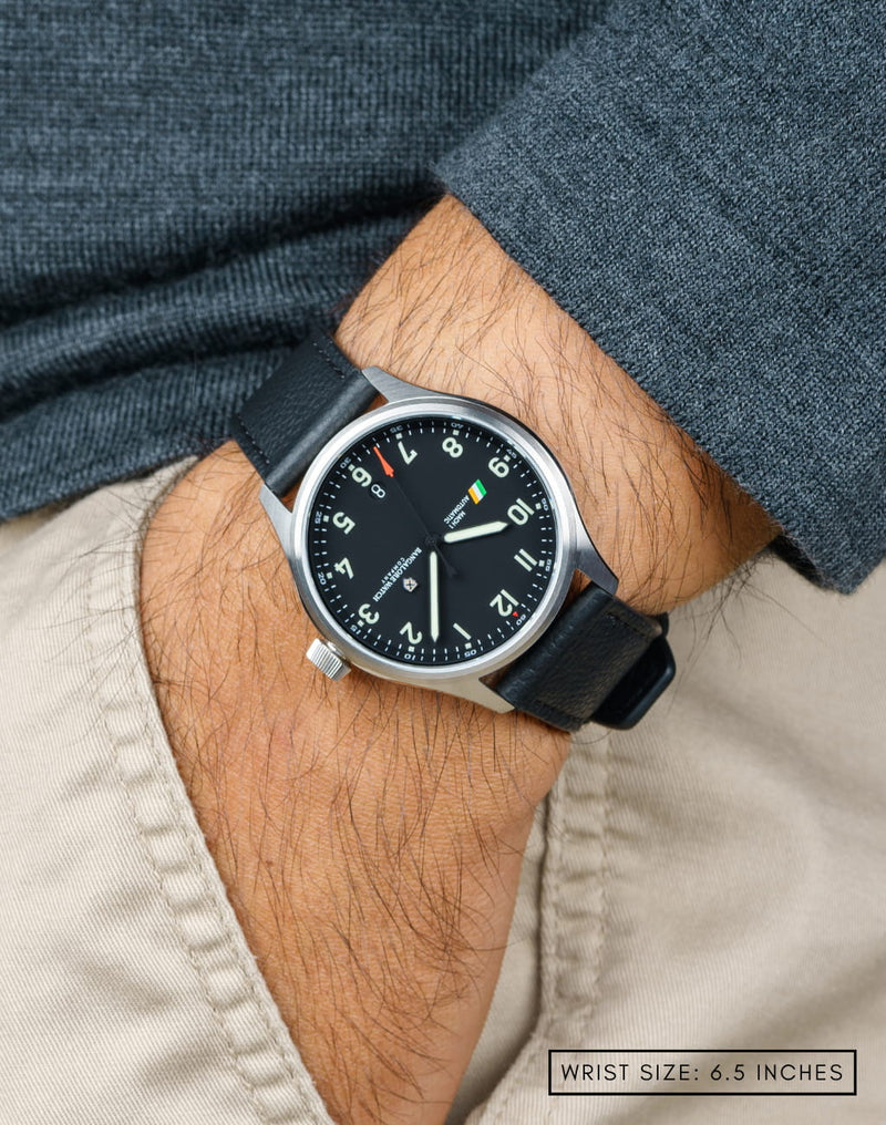 Man wearing MACH 1 Civilian Steel wristwatch with hand in pocket, showcasing the watch’s sleek design and aviation-inspired elements.