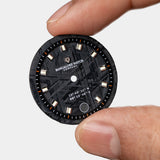 Close-up of the Visitor watch dial, featuring a unique Muonionalusta meteorite pattern, making each watch one-of-a-kind.