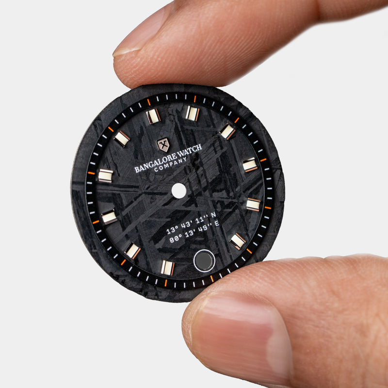 Close-up of the Visitor watch dial, featuring a unique Muonionalusta meteorite pattern, making each watch one-of-a-kind.