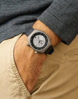Man wearing Apogee Extraterrestrial wristwatch, hand in pocket, showcasing the unique Muonionalusta meteorite dial.