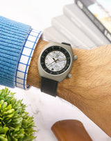 Man wearing Apogee Extraterrestrial on wrist, highlighting the 4.5 billion-year-old Muonionalusta meteorite dial in a Grade 2 Titanium case.